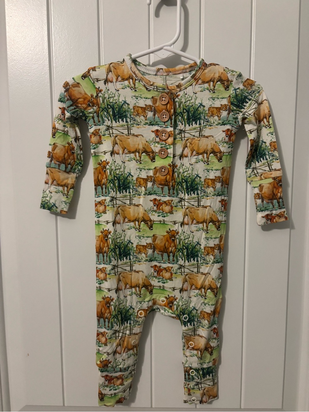 Buckaroo Baby Co. Cow Print One-Piece Bodysuit in Green and Brown